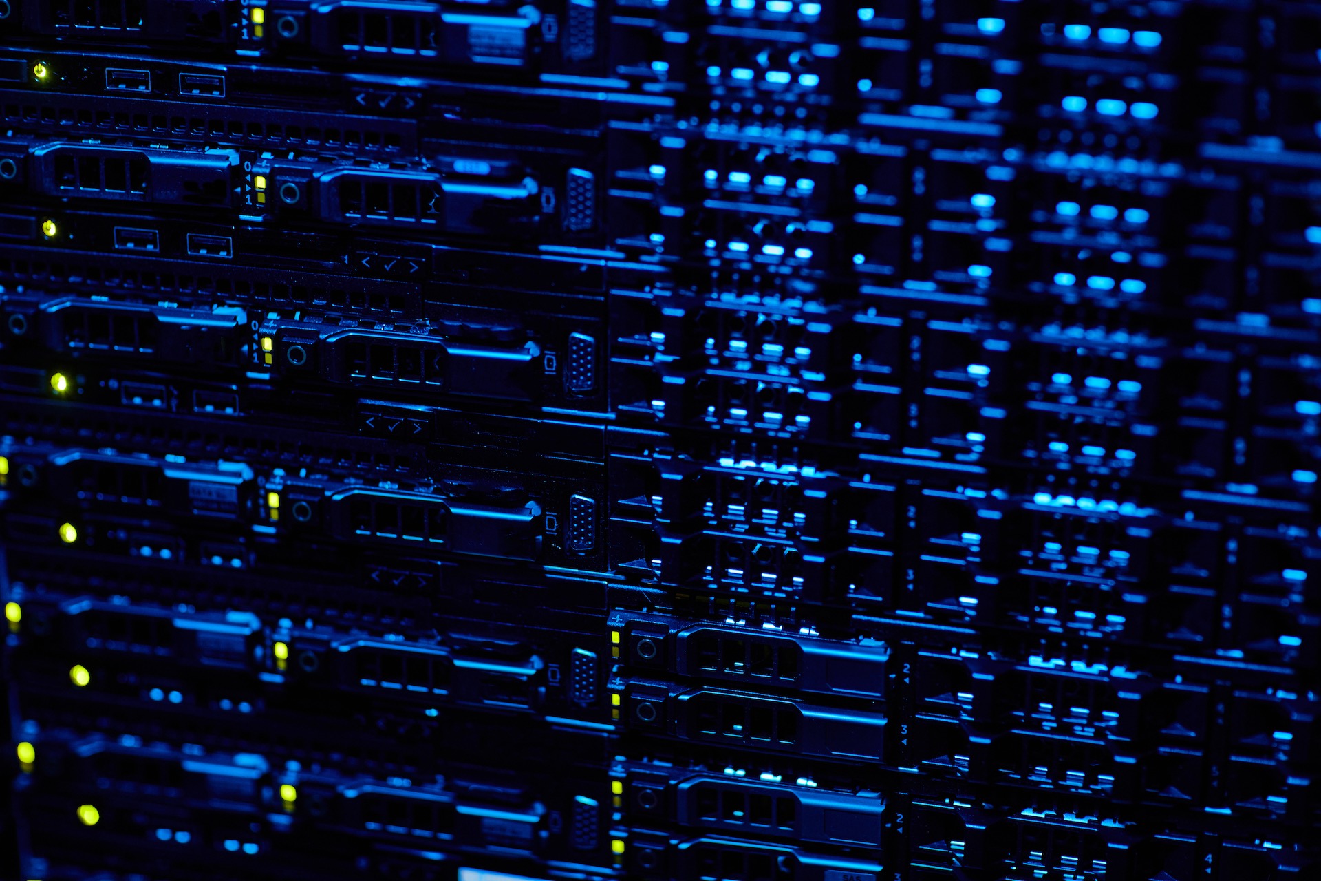 Background image of blade servers stacked in data center with blinking neon lights, copy space