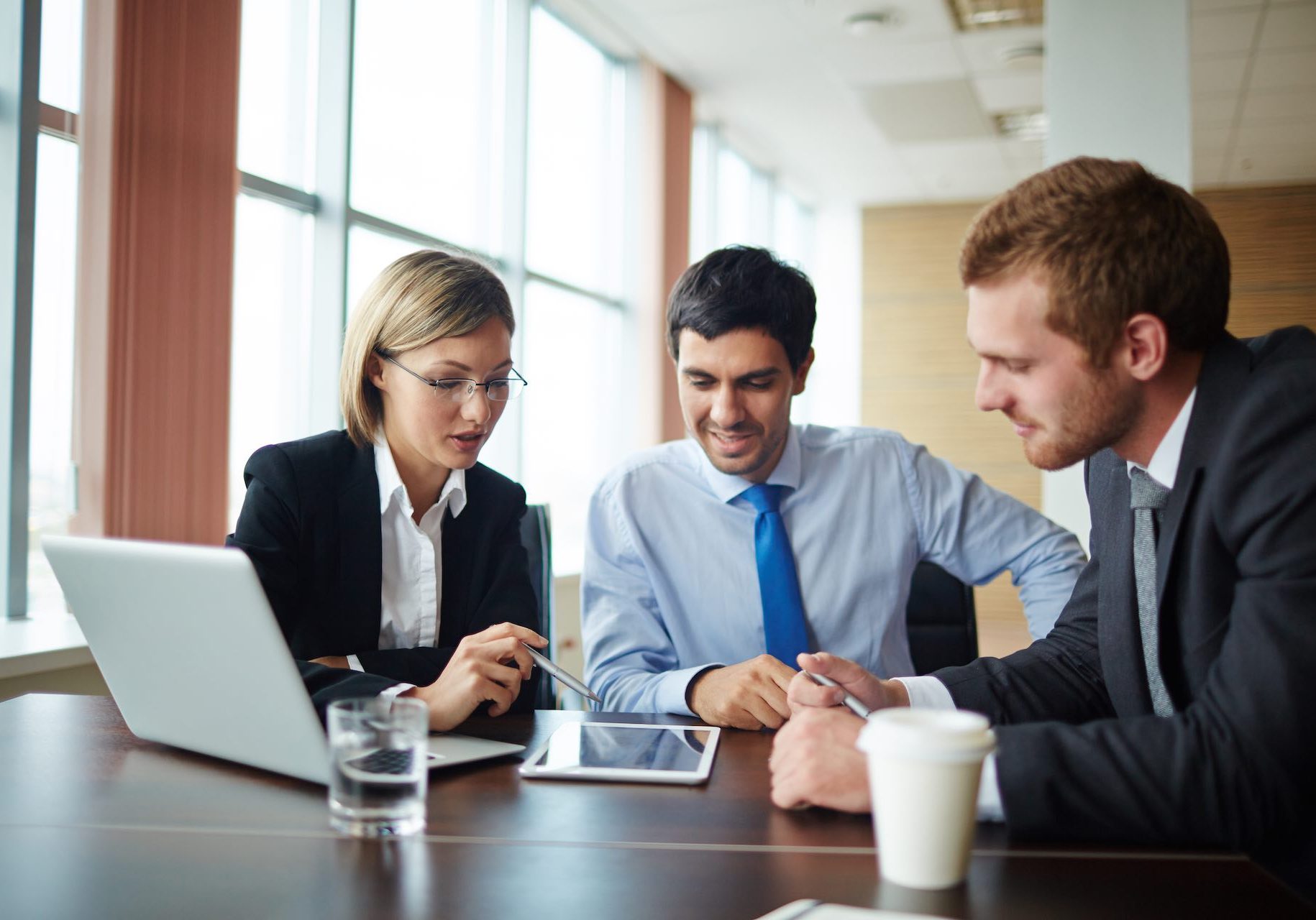 Business people working in team and using digital tablet