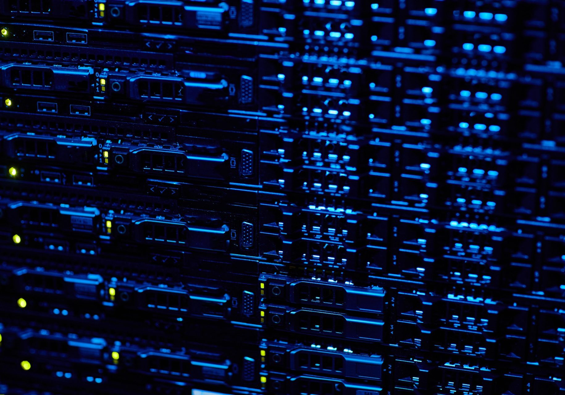 Background image of blade servers stacked in data center with blinking neon lights, copy space